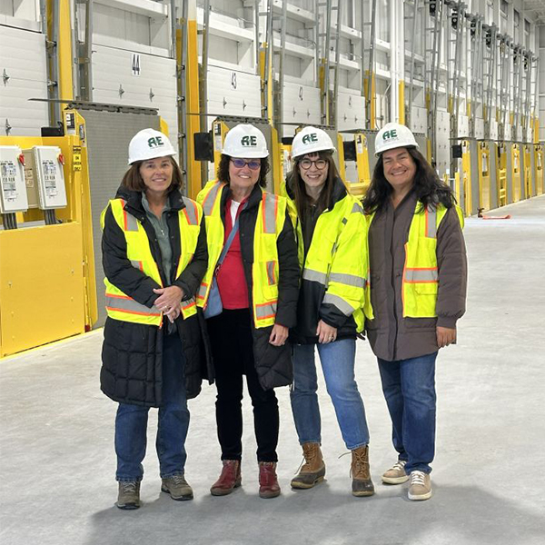 team of builders with yellow safety vests
